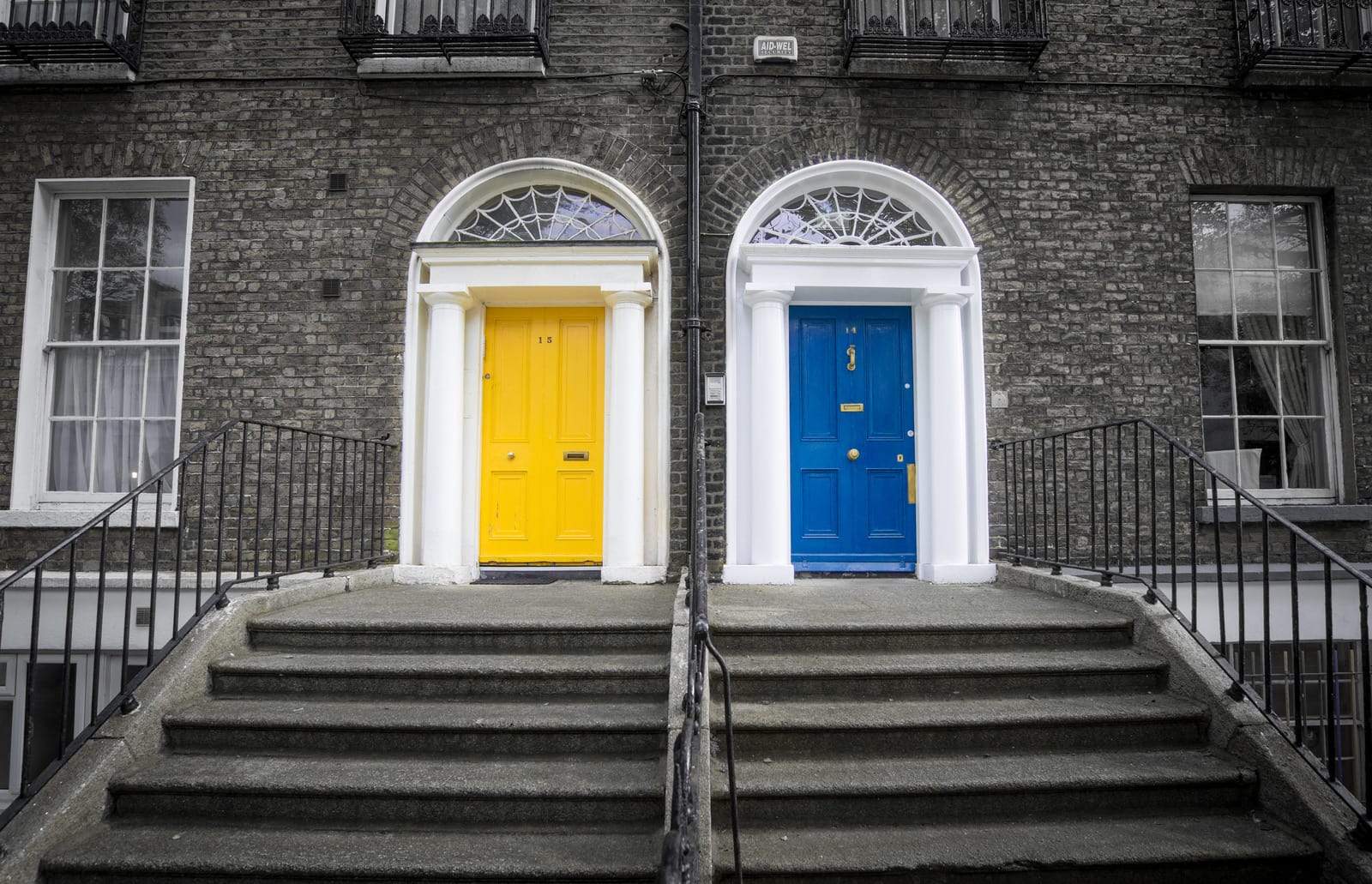 Canva-Two-Closed-Yellow-and-Blue-Doors-2
